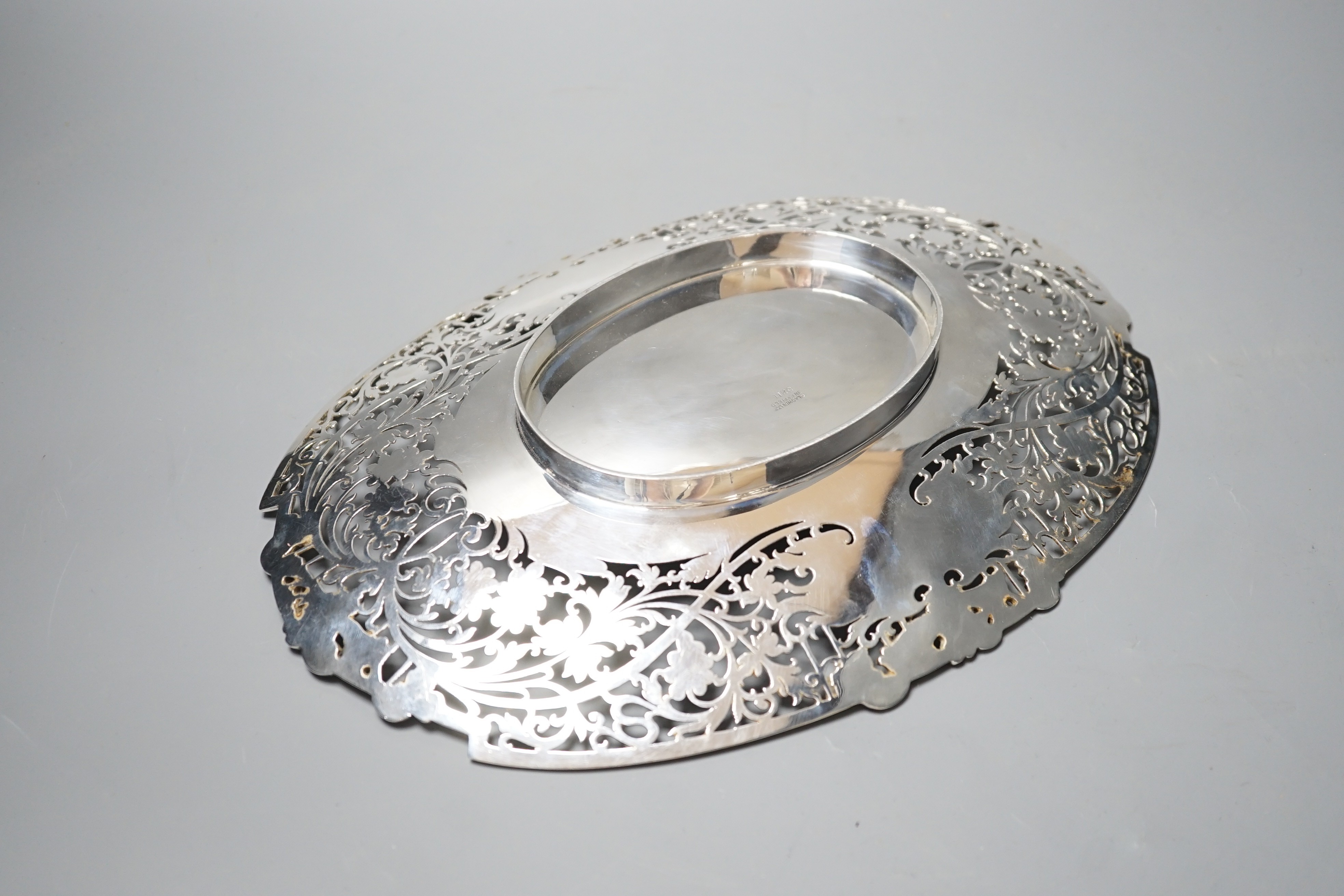A George VI pierced silver shallow dish, Sheffield, 1948, 30cm, 19oz.